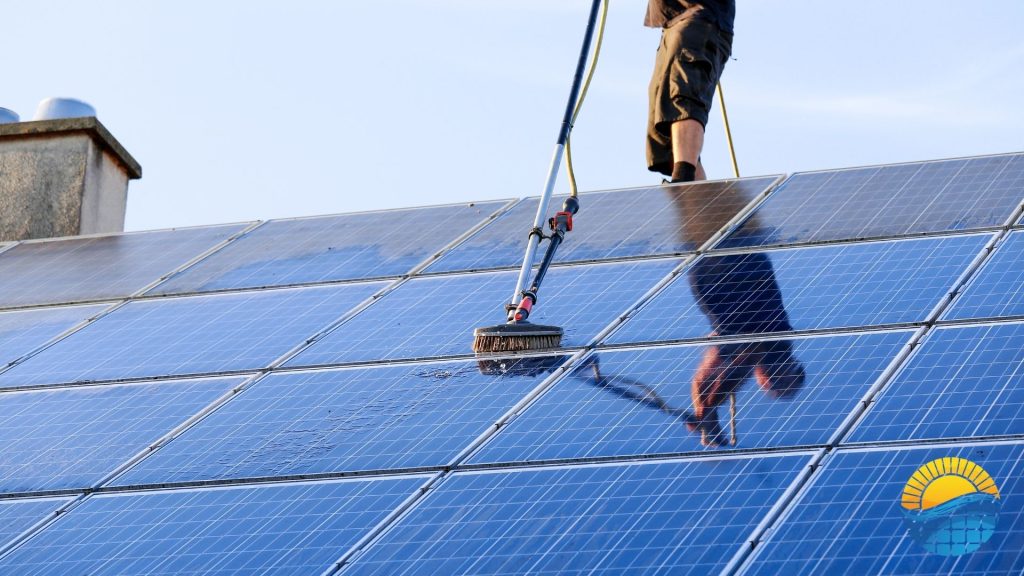 A person is cleaning solar panels on a roof