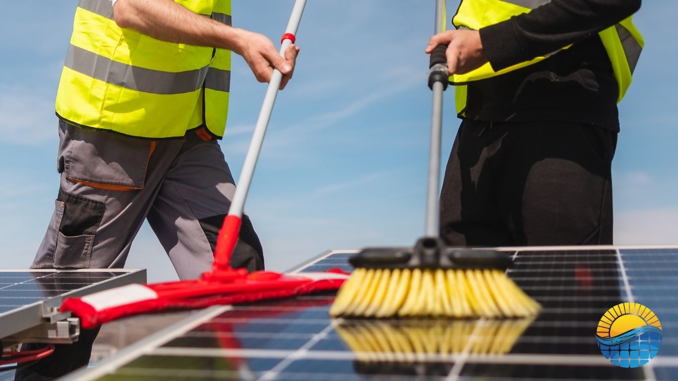 workers cleaning solar panels on the roof of a building
