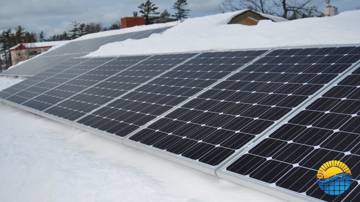 snowly solar panels on the roof of a house